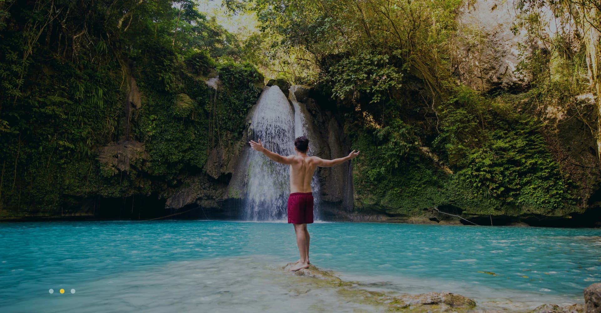 main in front of a falls